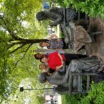 Students visit the Susan B. Anthony and Frederick Douglass statue, Let's Have Tea, in Susan B Anthony Square